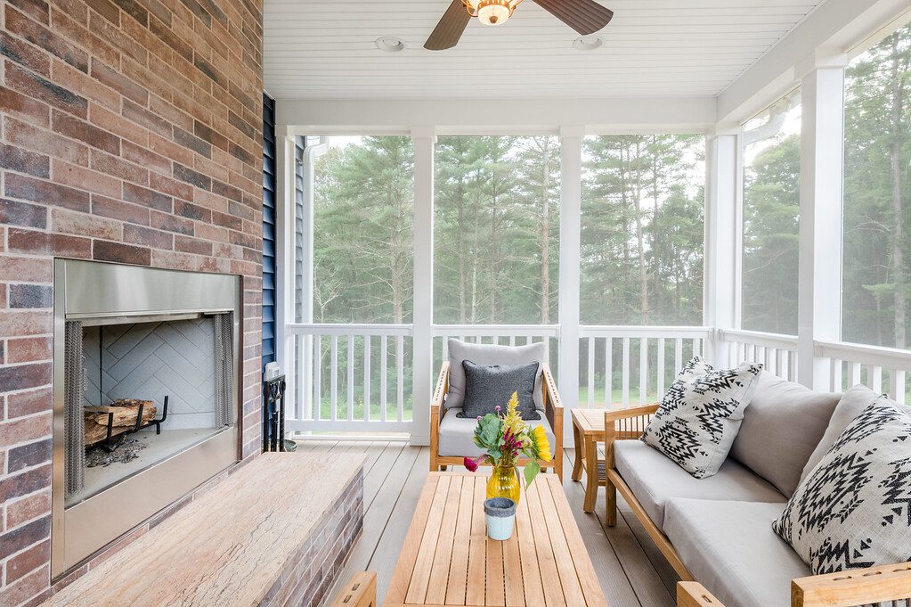 Screened in porch with fireplace